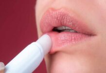 The Lip Balm Lie: What Marketers Aren’t Telling Close-up of a person applying lip balm to their lips