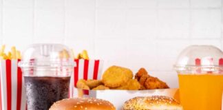 A variety of fast food items including burgers, fries, and drinks