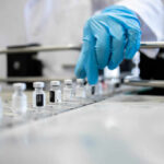Fear the Aging Clock? Vaccine May Pause It A healthcare professional in a lab preparing vaccine vials