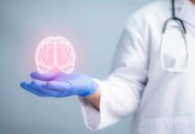 Brain Hack Slashes Dementia Risk by 25% A medical professional holding a glowing digital brain illustration in their hand
