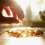 Fountain of Youth Linked to Cancer Growth A hand reaching for a golden capsule among many on a table