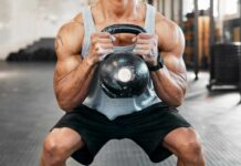 Squat-Cardio Debate: Are You Wrong? Athlete performing a kettlebell squat in a gym