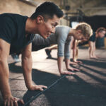 ACSM Unveils Game-Changing Strength Training Update Group of individuals performing push-ups in a gym