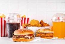 A variety of fast food items including burgers, fries, and drinks