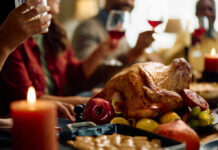 Scientists Uncover Protein Craving SWITCH! A beautifully roasted turkey surrounded by fruits and candles on a festive dining table
