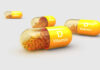 Vitamin D Supplements: The Downside You Didn’t Know Vitamin D capsules with orange beads inside