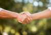 Two hands shaking in a gesture of agreement