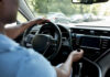 Flying Glass Panic Triggers Massive Vehicle Recall Drivers hands on the steering wheel inside a car