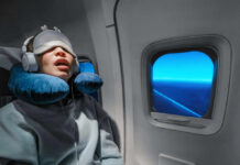 A massive study that turned snoring into a brain warning A passenger sleeping on an airplane with headphones and an eye mask