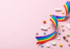 Birth Control Pills’ Hidden Heart Trap Colorful pills and a rainbow ribbon on a pink background