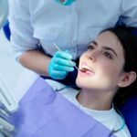 Dentists Warn: Receding Gums Signal Bigger Trouble Patient receiving dental checkup