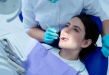 Dentists Warn: Receding Gums Signal Bigger Trouble Patient receiving dental checkup