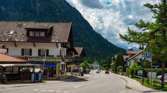 shutterstock_1749272663 mountain village street with alpine houses and shops
