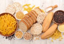 Assorted grains and breads on a wooden table