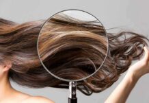 Magnifying glass highlighting long brown hair