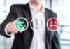 Businessperson selecting a happy face rating icon