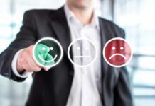 Businessperson selecting a happy face rating icon