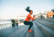 Why Exercise Timing Is Important Woman exercising on outdoor steps by a riverside