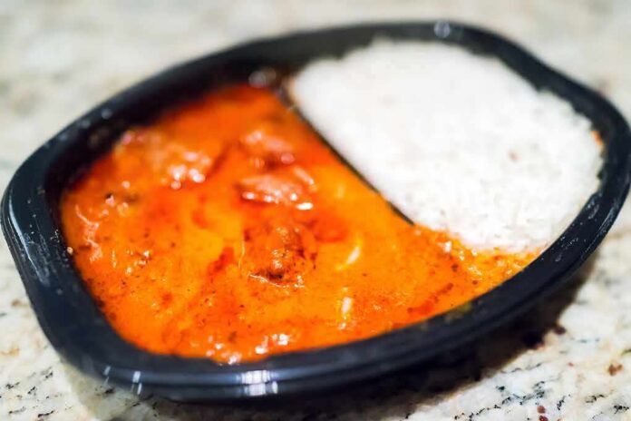 Microwavable tray with curry and white rice