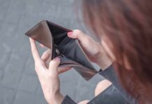 Hands holding an open empty wallet