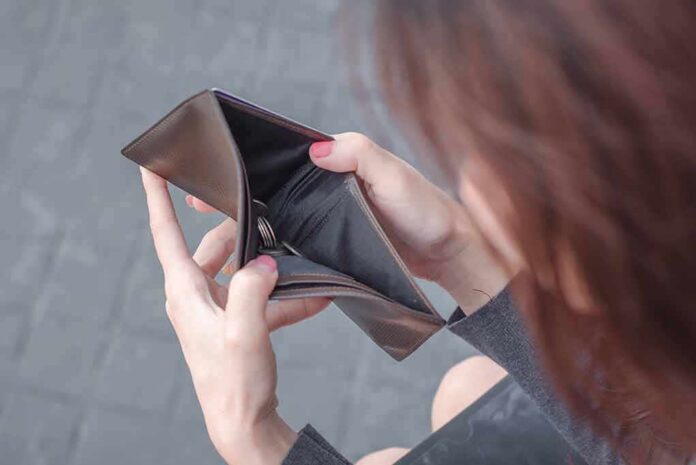 Hands holding an open empty wallet
