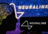 Mind-To-Mouth Breakthrough Stuns Scientists Silhouette of a head with circuitry beside Neuralink logos