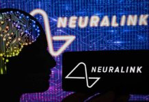 Silhouette of a head with circuitry beside Neuralink logos