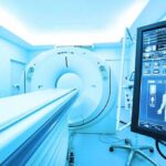 MRI or CT scanner with control monitor in hospital room