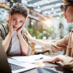 Friendship Checklist: 5 Types of Toxic Friendships to Avoid Two women at a table, one comforting the other