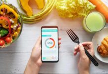 New Fuel Ceiling Upends Endurance Rulebook hands holding phone with calorie tracker beside salad and pastry