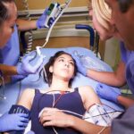 Heart Attack Vs. Cardiac Arrest Vs. Heart Failure – Big Difference Patient on hospital gurney surrounded by medical staff