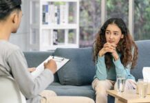 Young woman sitting on couch during counseling session