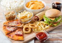 Assorted fast food on a wooden board