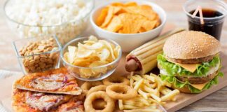 Assorted fast food on a wooden board