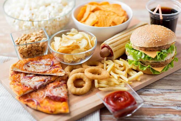 shutterstock_288575585 Assorted fast food on a wooden board