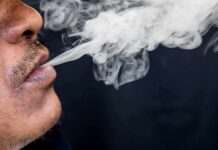 Close-up of a person exhaling smoke